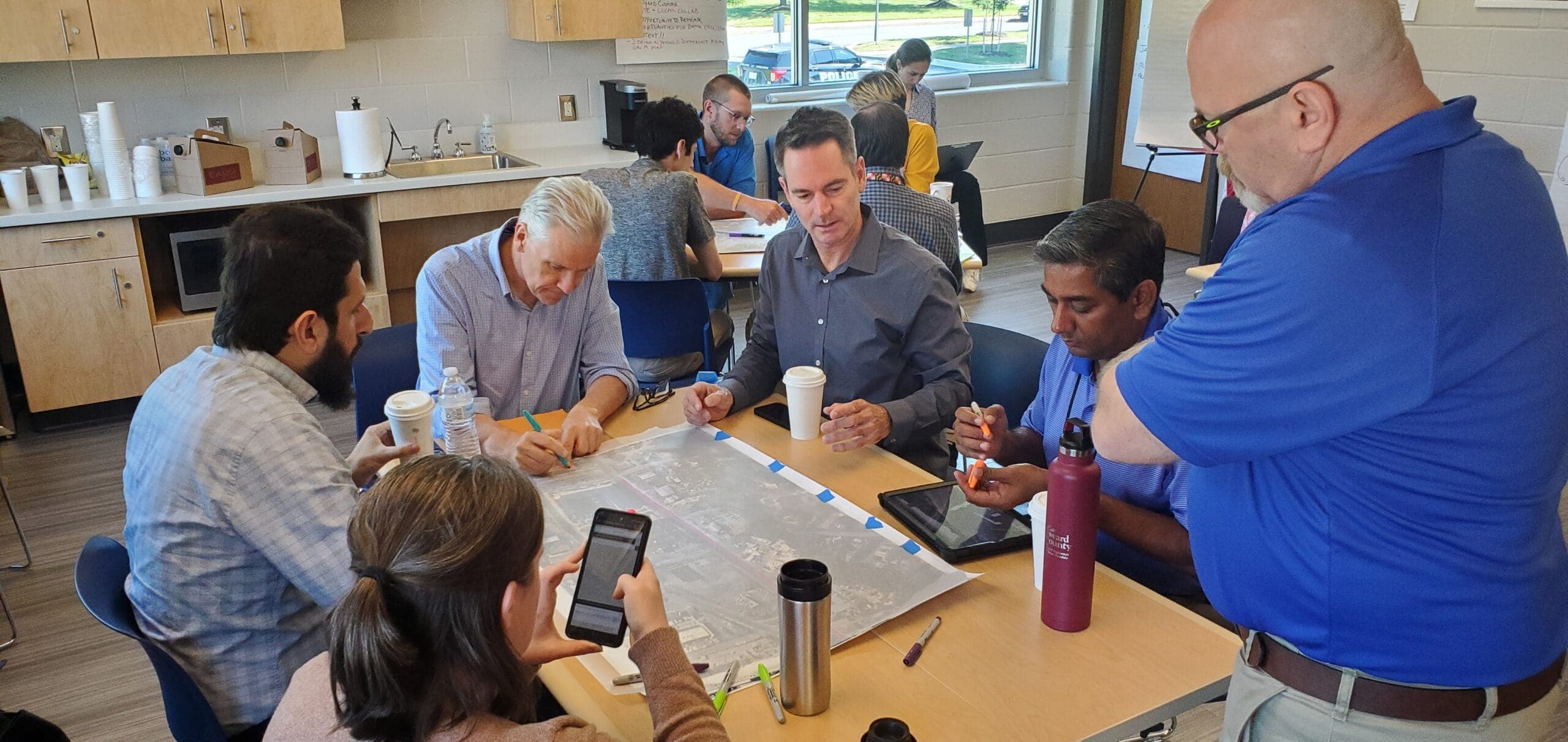 MD CSLA 2024 map exercise A group of transportation planners and engineers discusses the potential design of a Complete Streets project