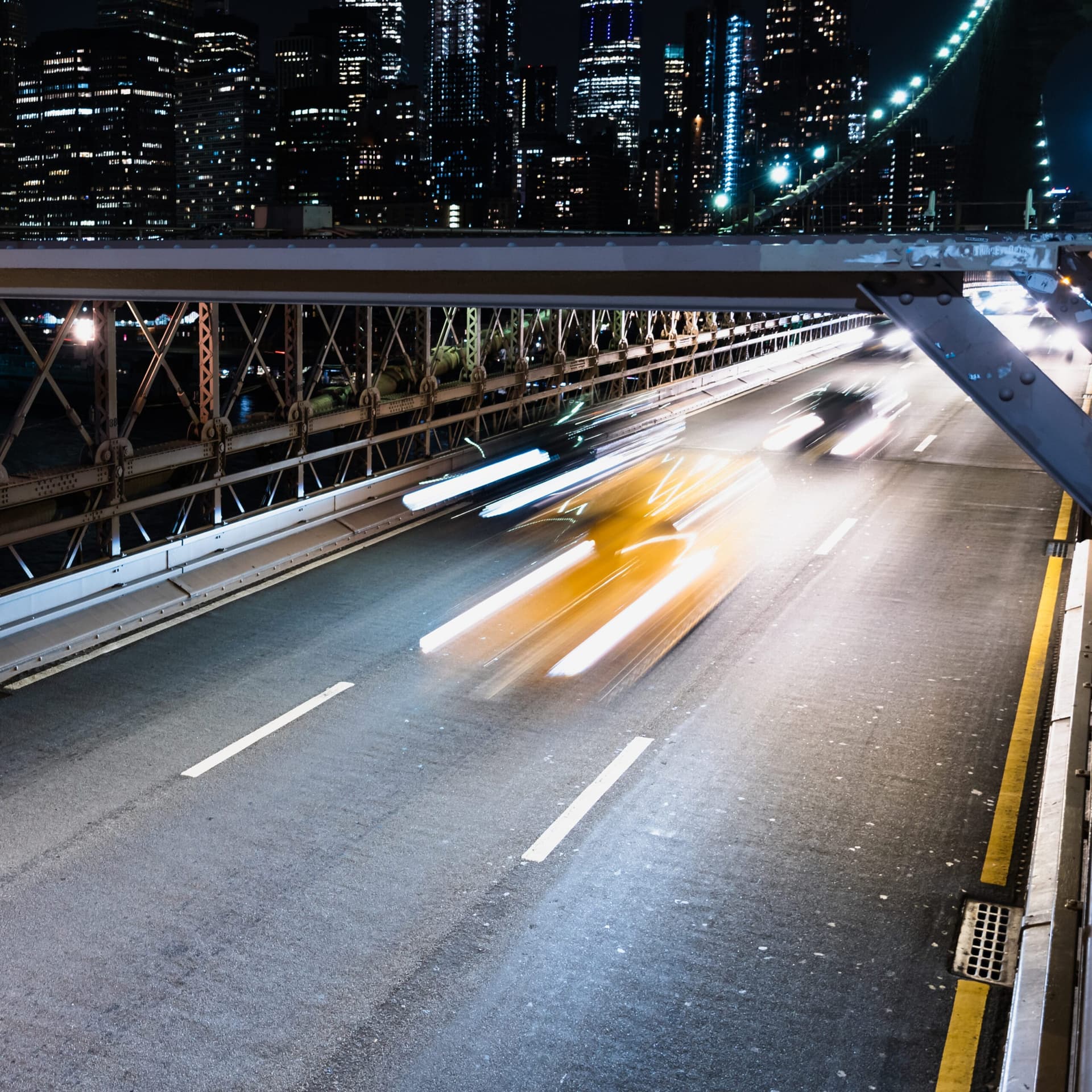 vehicles-bridge-with-motion-blur-night