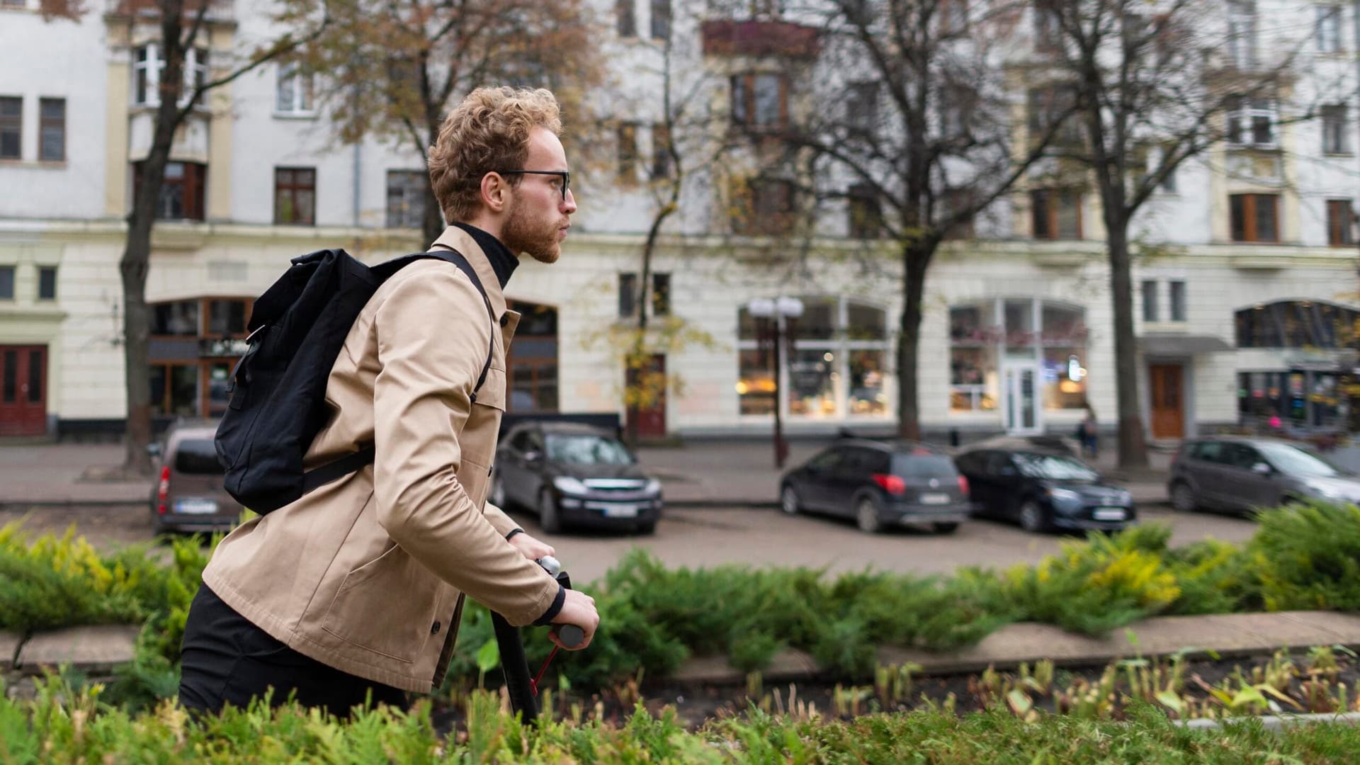 handsome-male-riding-electric-scooter